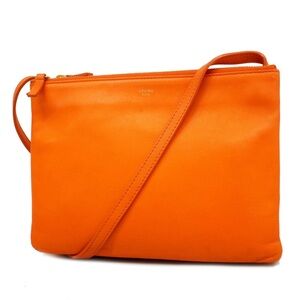 Celine Trio Large bright orange excellent condition With Tags 100% Lambskin